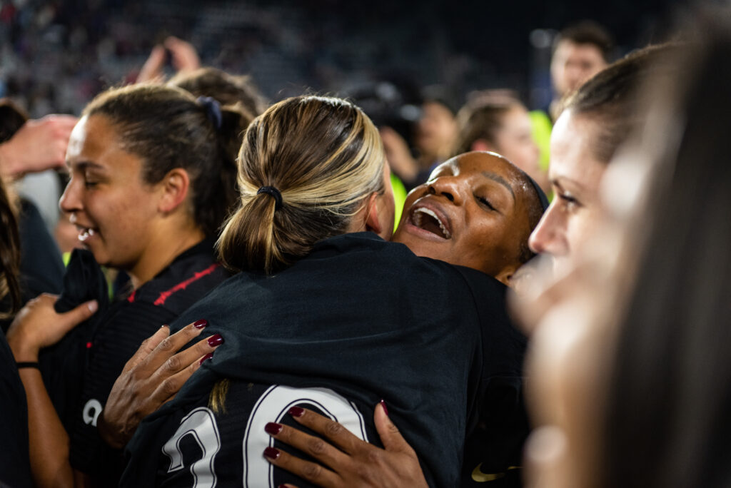 Crystal Dunn celebrates the Portland Thorns' championship with an embrace on October 29, 2022. (Domenic Allegra photo)