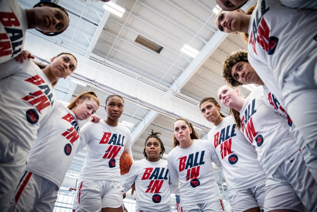Dayton huddles before the A-10 tournament championship game against UMass on March 6. 2022.