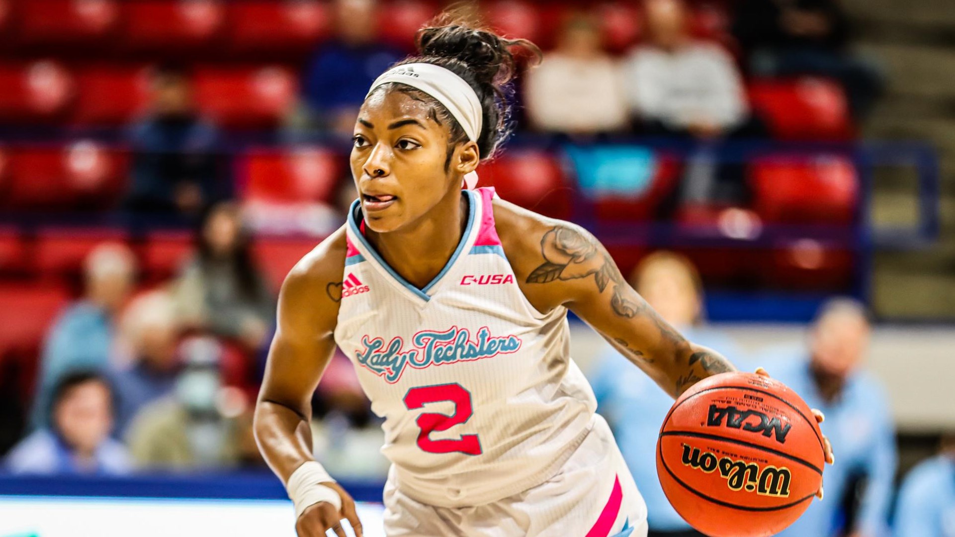 Keiunna Walker of Louisiana Tech dribbles the ball.
