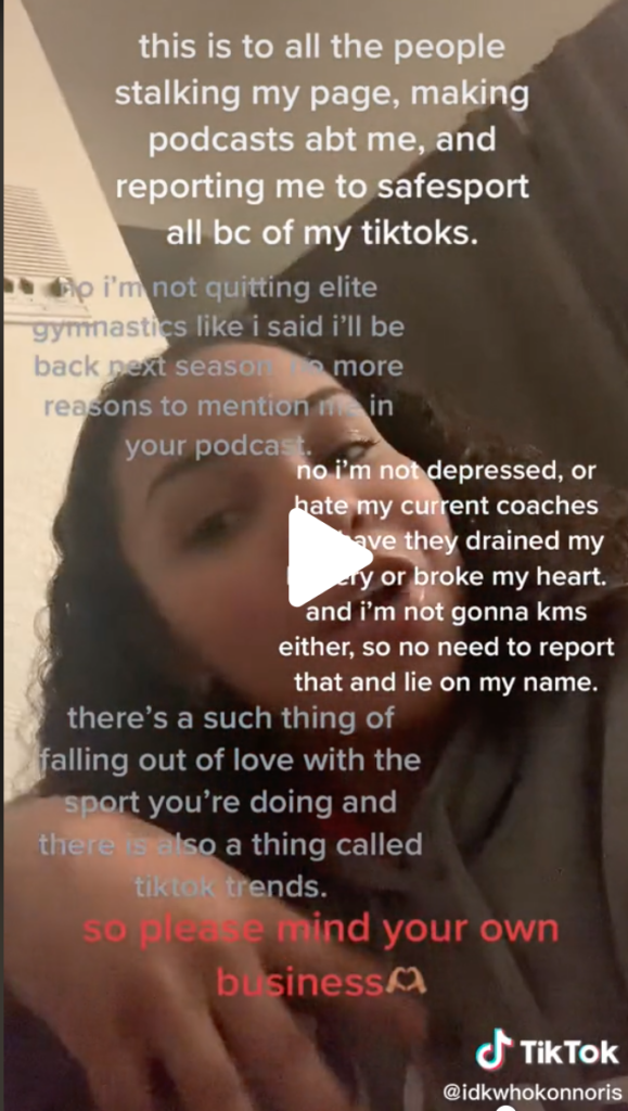 A video of Konnor McClain with text overlaid explaining that she is not quitting elite gymnastics. The text is addressed "to all the people stalking my page, making podcasts abt me, and reporting me to SafeSport."