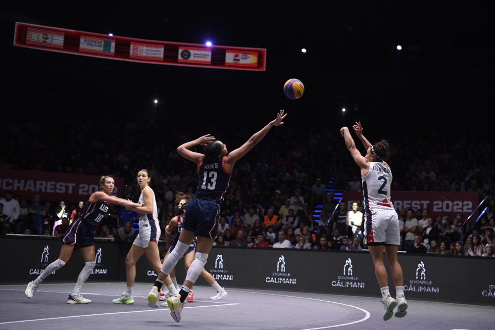France's Coline Franchelin (2) shoots over USA's N'dea Jones (13)