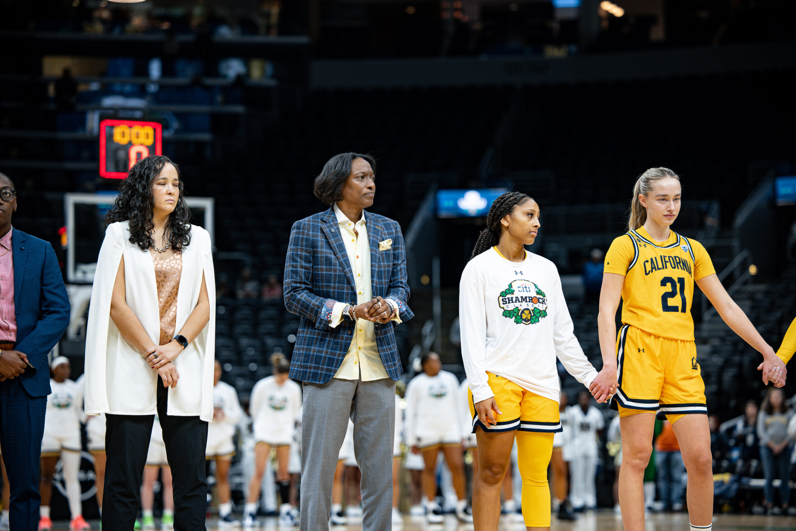 Cal coach Charmin Smith and her team waits for tipoff.