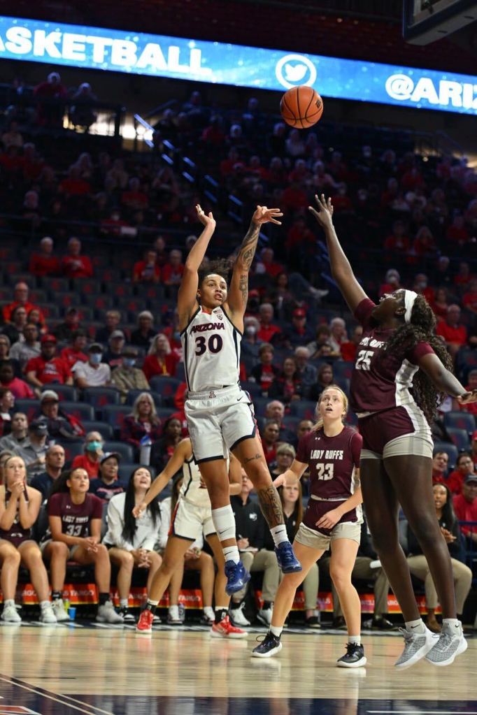 Arizona's Jade Loville shoots the ball with her left hand from close range.