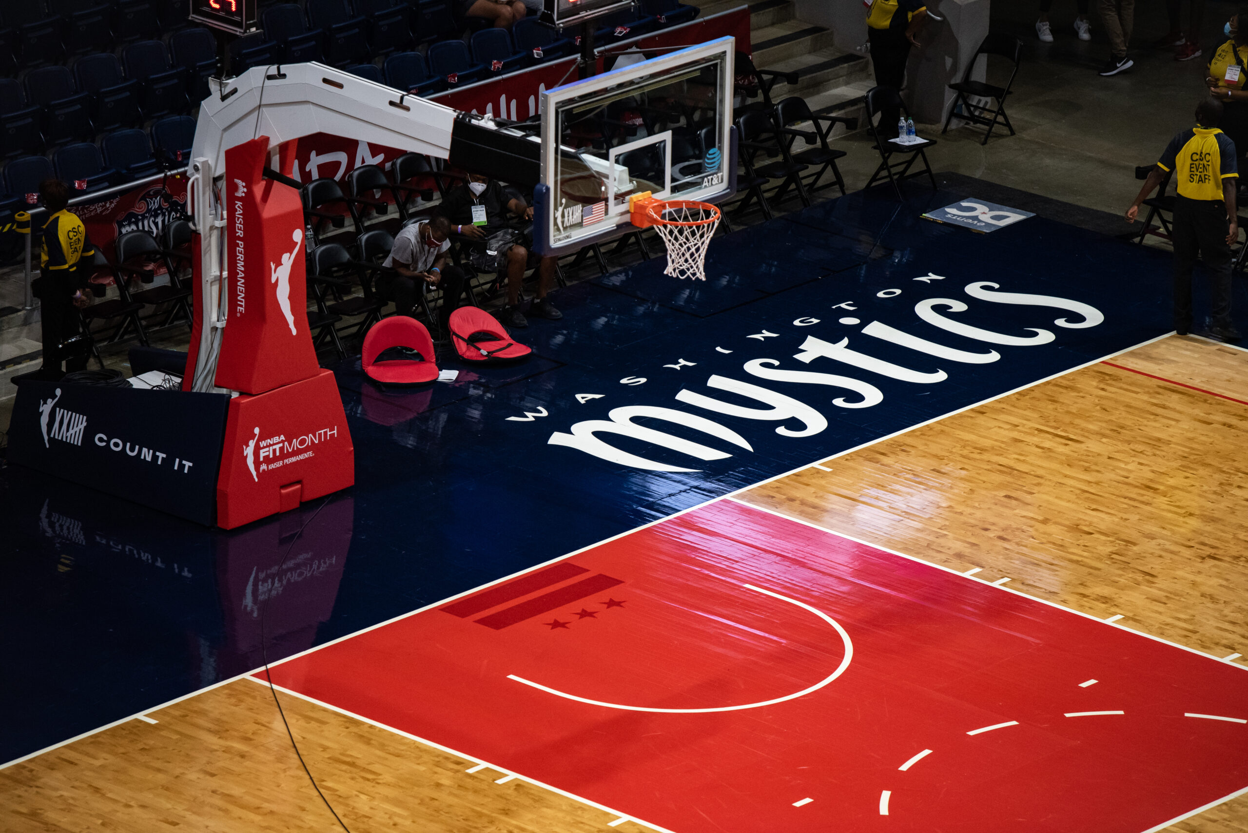 A view of part of the court at the Entertainment and Sports Arena, including one basket and most of the lane, plus the Washington Mystics' name on the baseline.