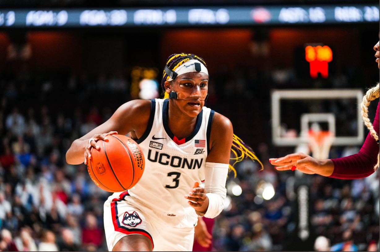 UConn's Aaliyah Edwards drives to the basket against a Florida State defender.