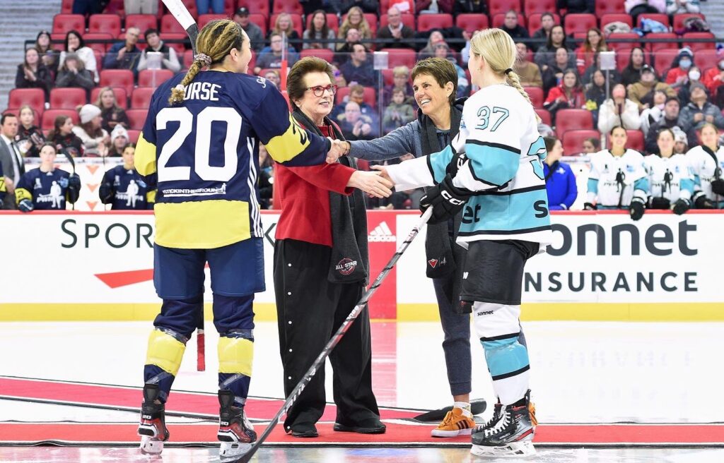 Sarah Nurse (20) shakes hands with Ilana Kloss and Rebecca Leslie (37) shakes hands with Billie Jean King at center ice.
