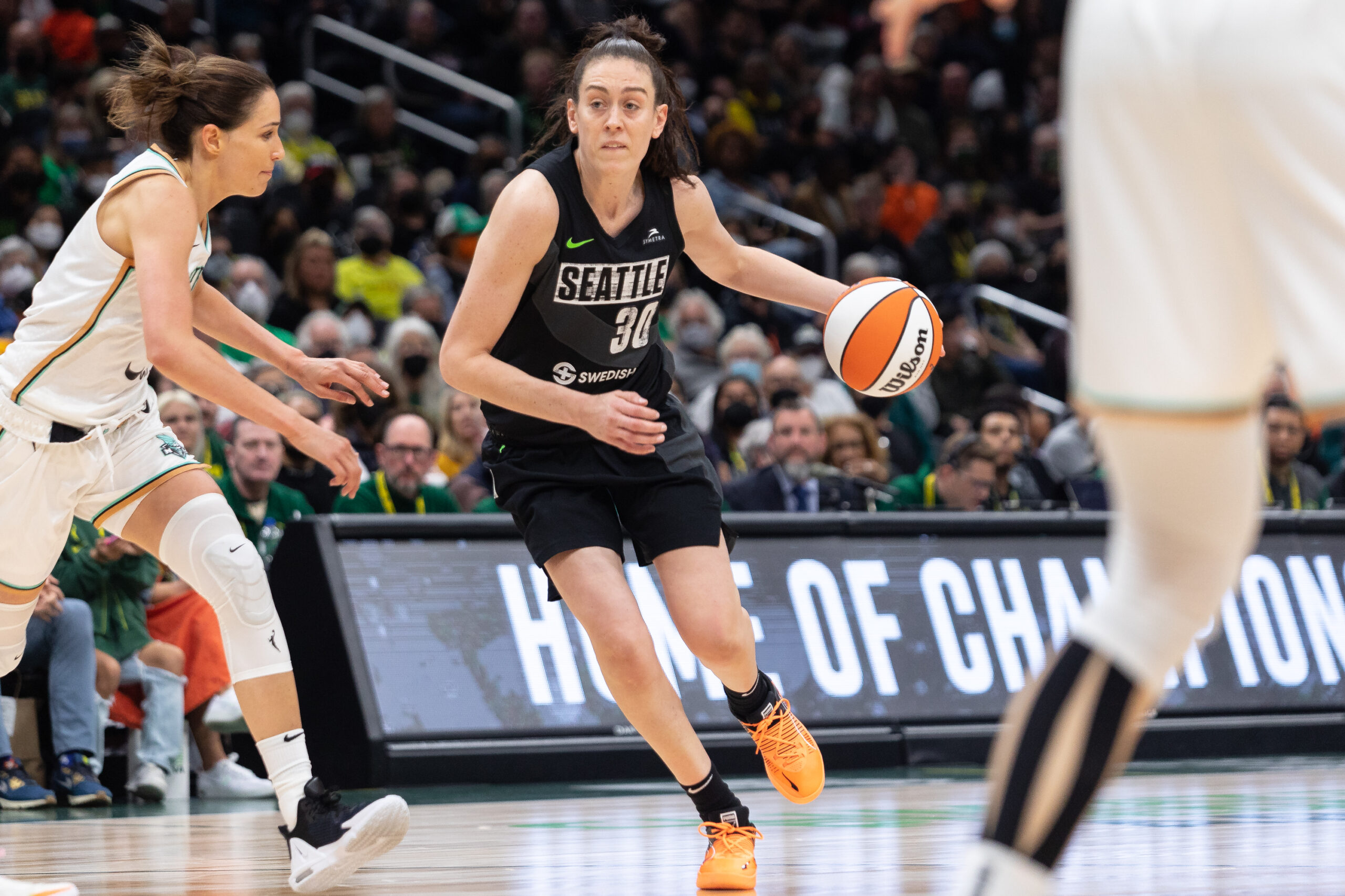 Seattle Storm forward Breanna Stewart dribbles toward the basket with her left hand.