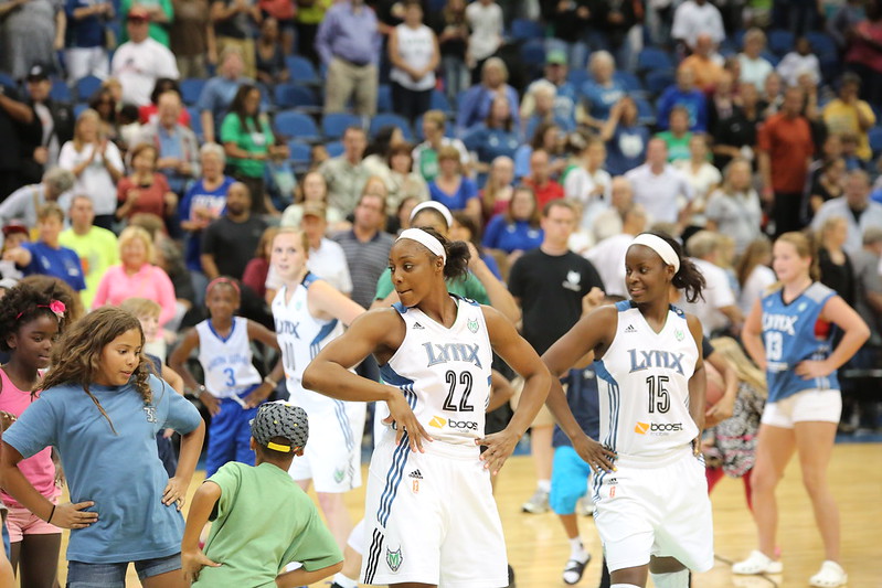 Monica Wright Rogers (22) having fun with fans at a 2013 Minnesota Lynx game. (Photo Credit: John McLellan)