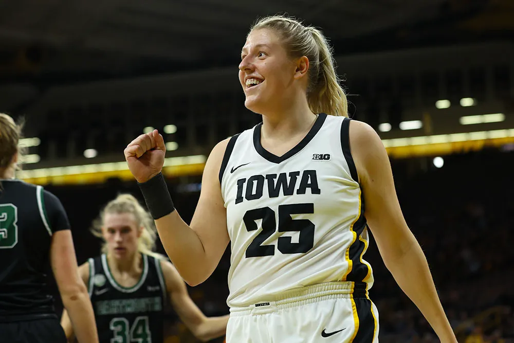 Monika Czinano pumps her fist after making a layup