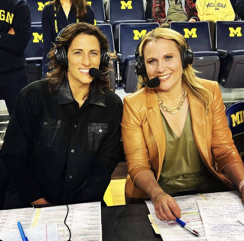Lisa Byington and Stephanie White are seated courtside wearing their television headsets during the first-ever Big Ten women's college basketball game on FOX.