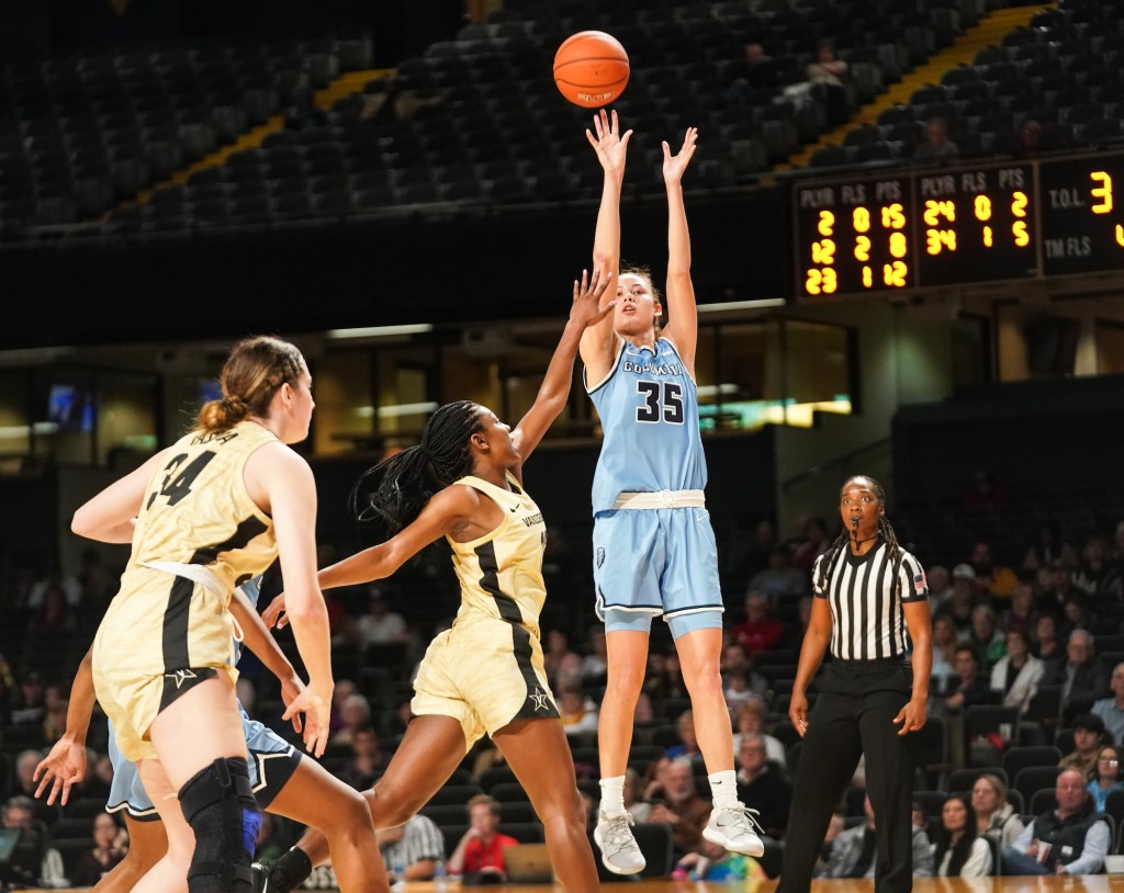 Columbia guard Abbey Hsu shoots a jump shot as a Vanderbilt defender races out to contest it with one hand up.