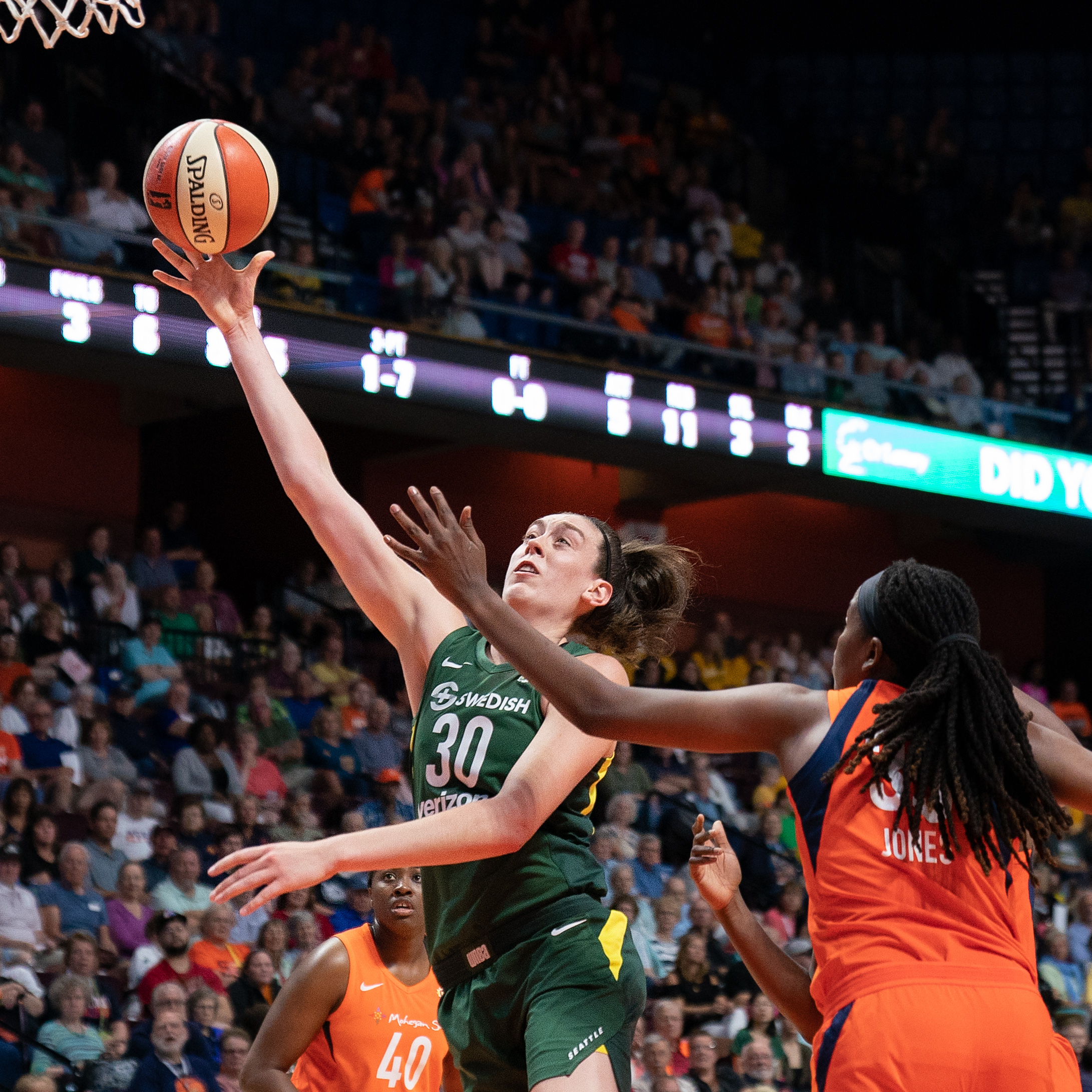 Seattle Storm forward Breanna Stewart attempts a short-range shot as Connecticut Sun center Jonquel Jones attempts to contest.