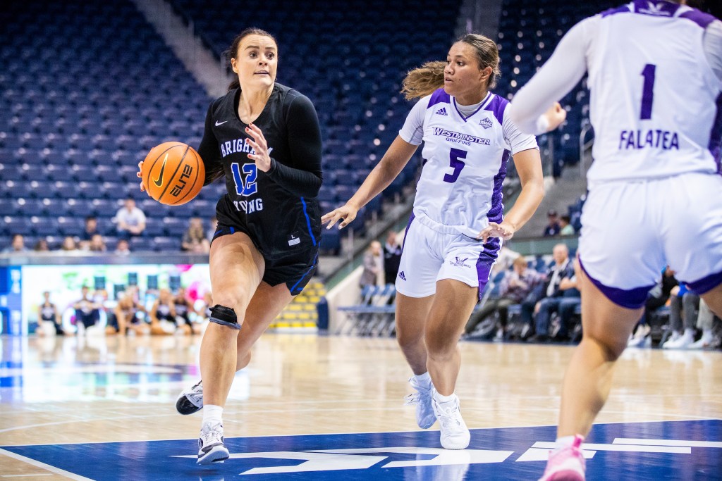 Lauren Gustin drives against Westminster. Photo Credit: BYU Photo