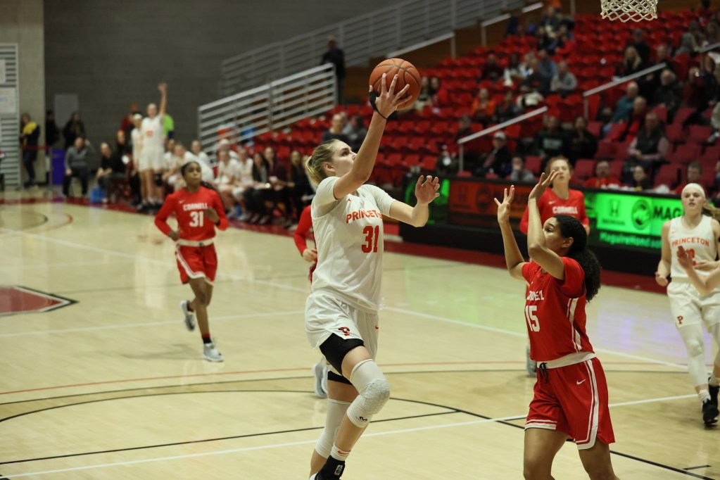 Bella Alarie shoots a right-handed layup.