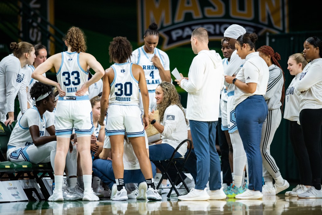Rhode Island huddles up during a timeout against George Mason on Jan. 25, 2023.