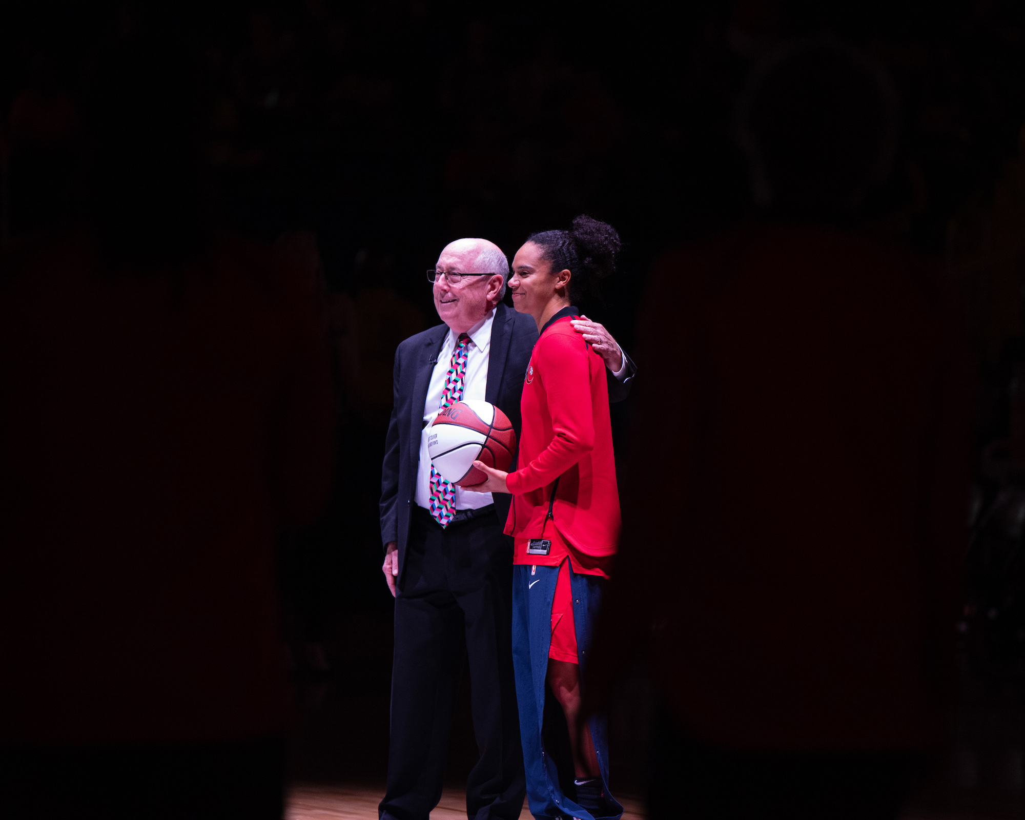 Washington Mystics general manager and then-head coach Mike Thibault poses for a photo with guard Kristi Toliver.