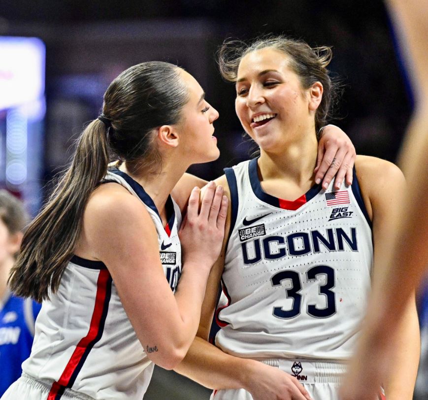 UConn guards Nika Mühl (left) and Caroline Ducharme (right) embrace during the final moments of UConn's 62-60 victory over Creighton on Wednesday, Feb. 15, 2023. (Photo Credit / UConn Women's Basketball Twitter)