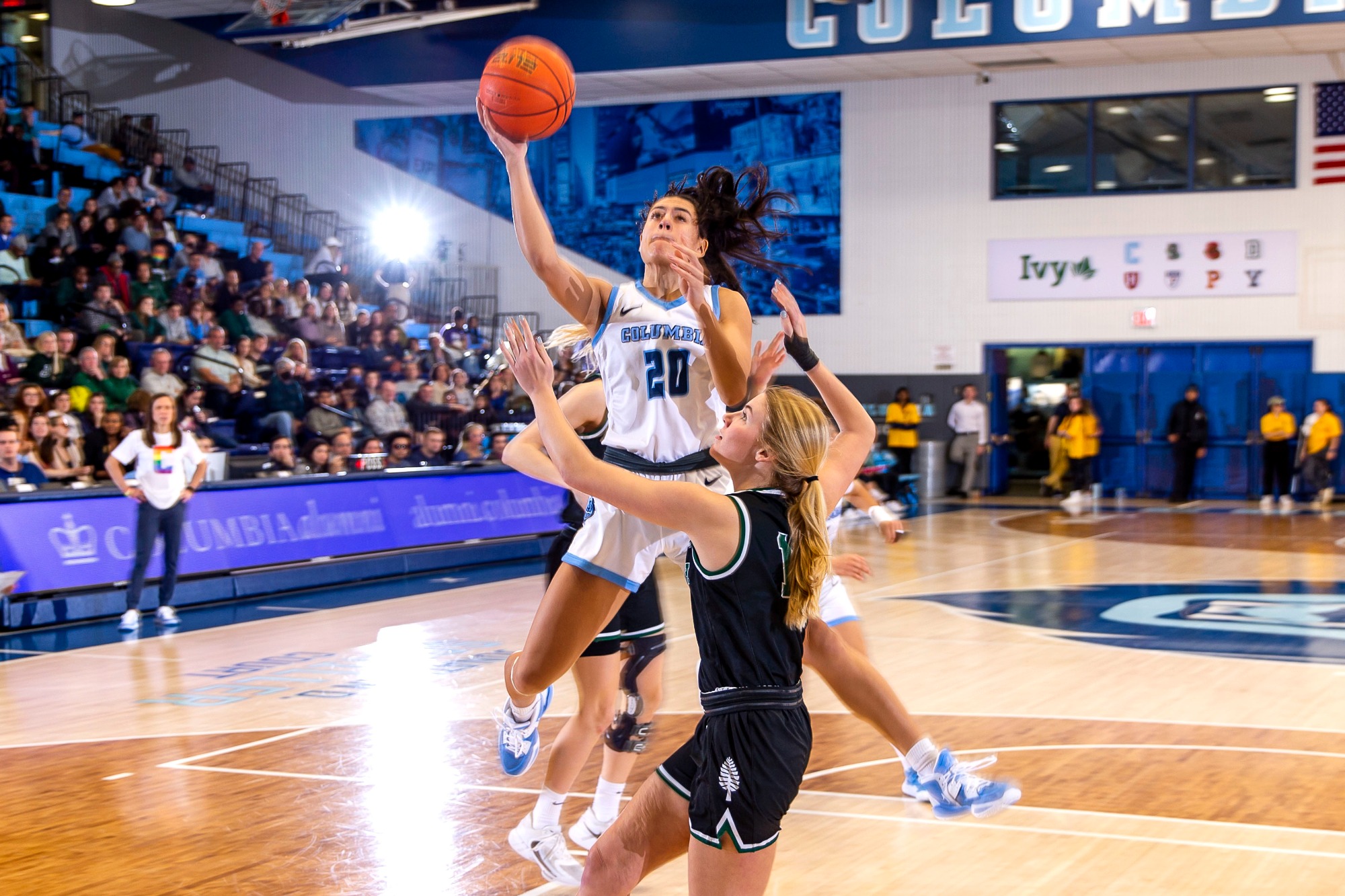 Sienna Durr shoots a right-handed shot from close range as a defender contests.