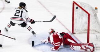Northeastern hockey players score a goal at a recent game.