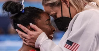 Cecile Landi, right, with Simone Biles at the Tokyo Olympics following Biles' bronze-medal winning routine in the balance beam final./Today.com - Robert Gauthier for the Los Angeles Times via Shutterstock