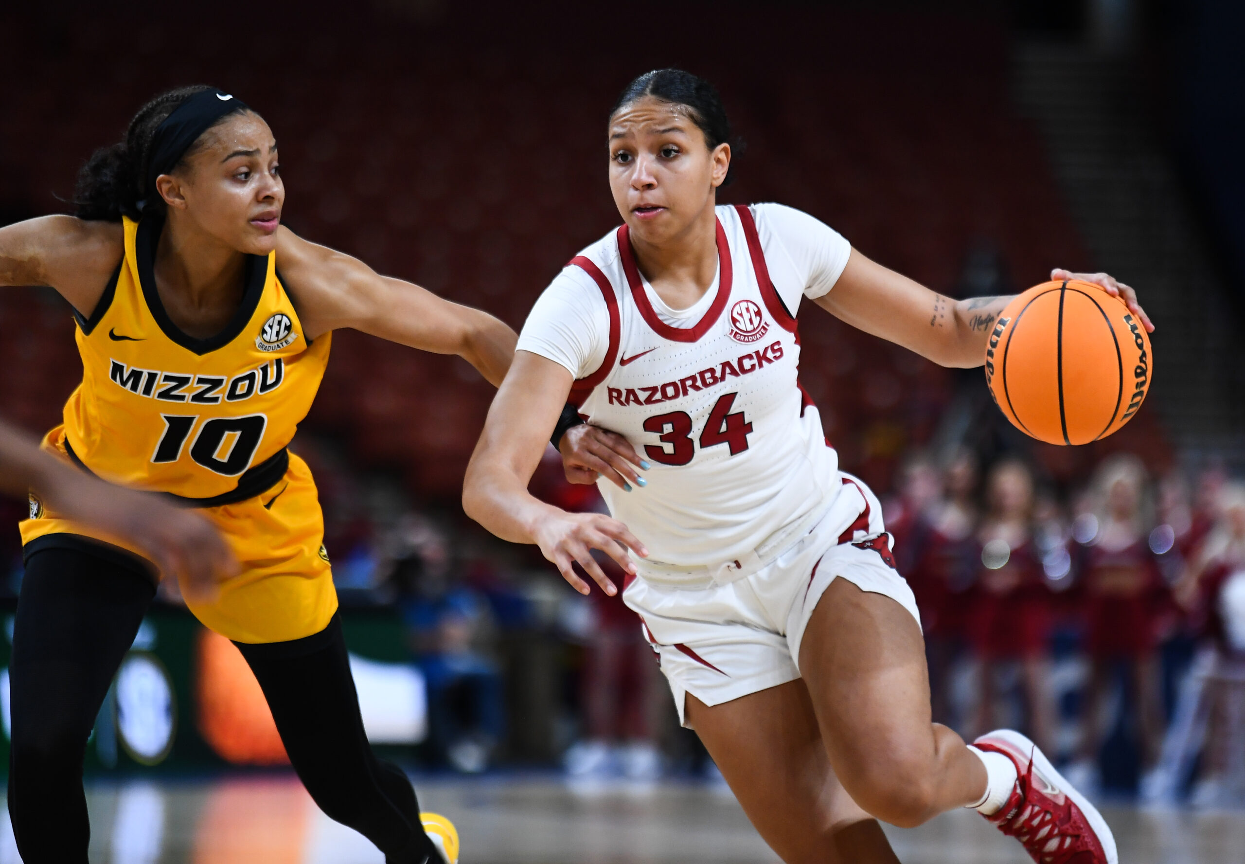 Arkansas' Chrissy Carr dribbles with her left hand against Missouri in the SEC Tournament.