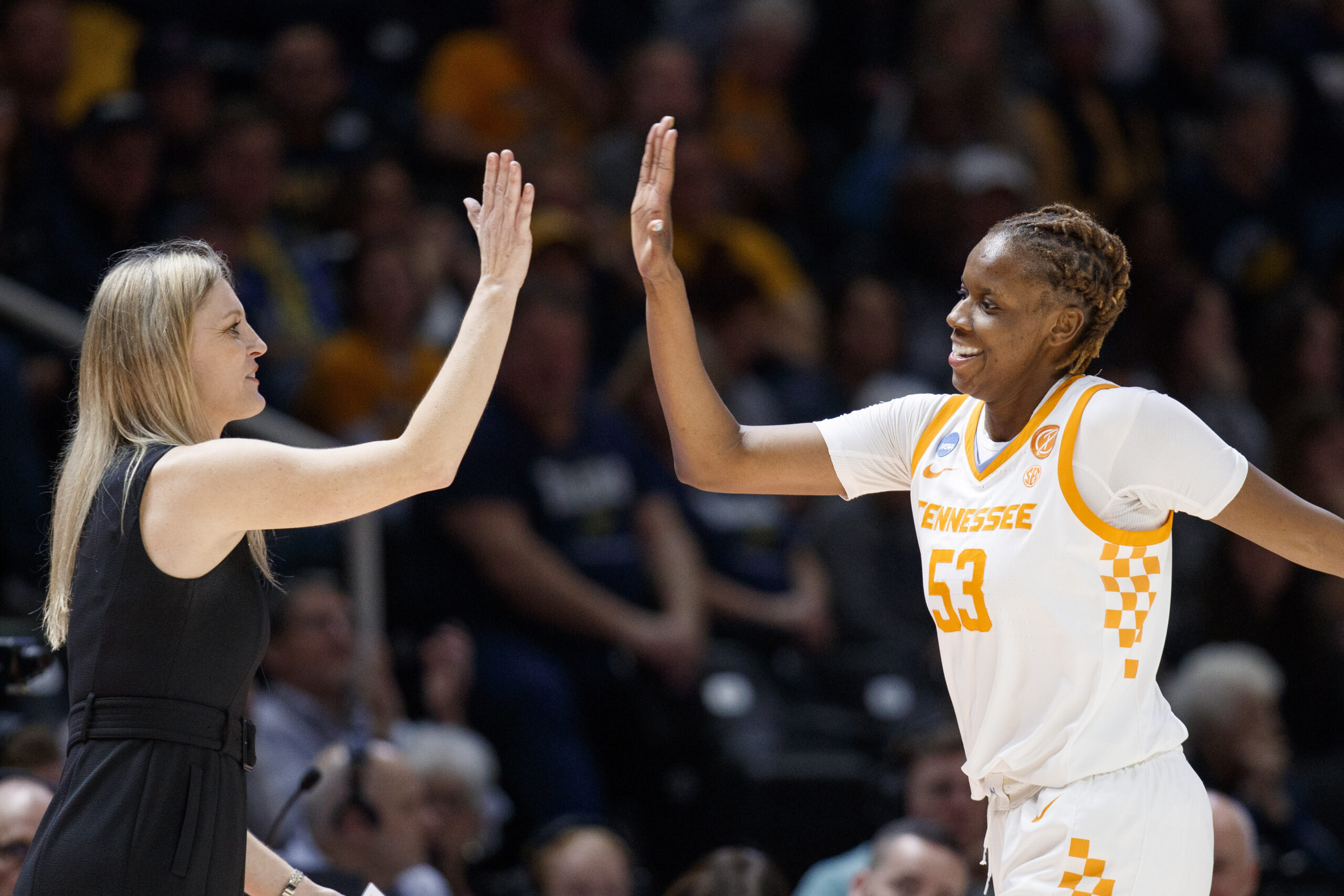 Vols head coach Kellie Harper and forward Jillian Hollingshead high five