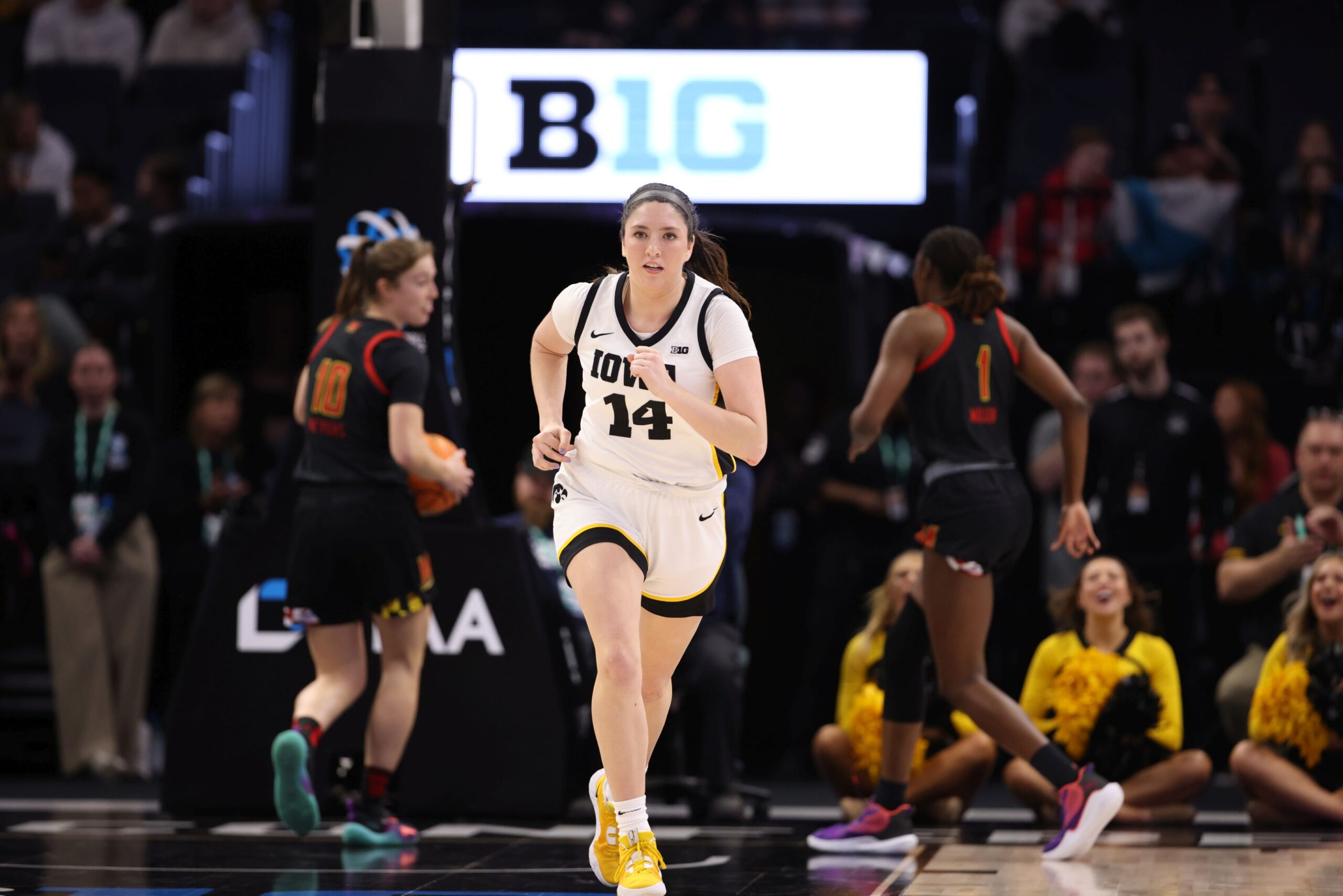 Iowa guard/forward McKenna Warnock runs up the court.