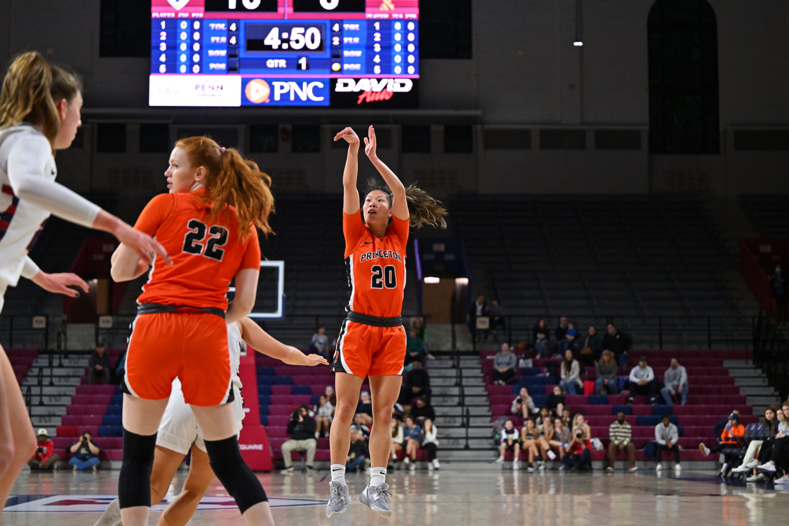 Princeton guard Kaitlyn Chen follows through on an open jump shot, with no defenders close enough to contest it.