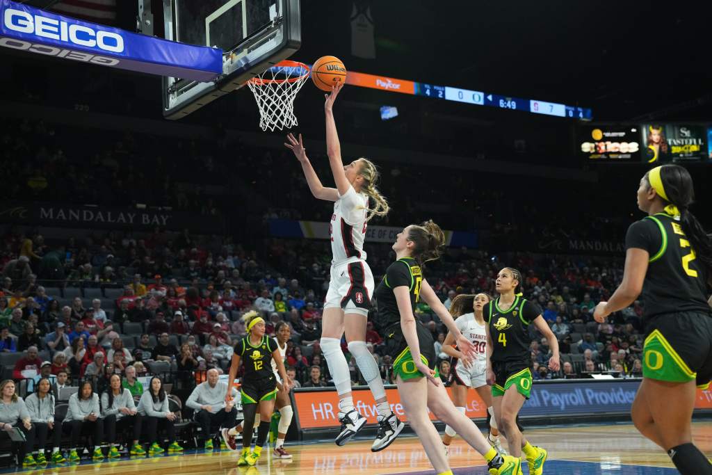 Stanford's Cameron Brink shoots a left-handed layup, her hand just inches from the rim.
