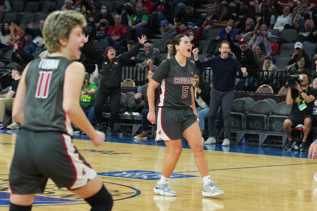 Washington State's Charlisse Leger-Walker yells in celebration after hitting a big shot against Utah.