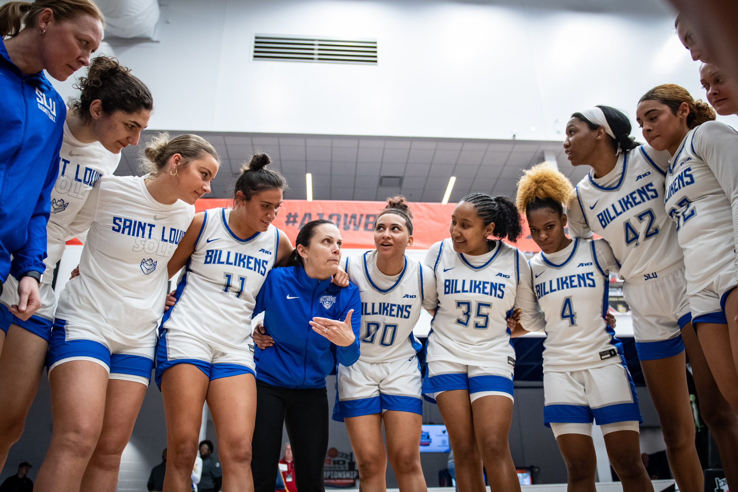 Saint Louis head coach Rebecca Tillett talks to her team in the huddle.