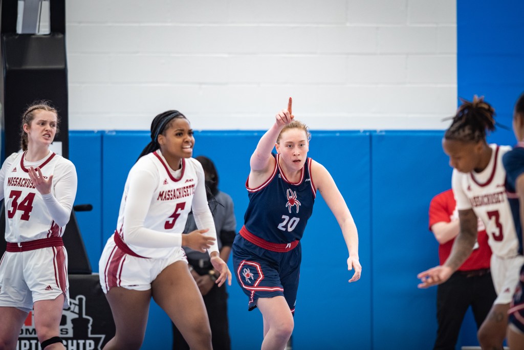 Richmond's Addie Budnik, points to her teammate after a layup in the team's A-10 Tournament semifinal game against UMass on March 4, 2023. Photo Credit: Domenic Allegra.