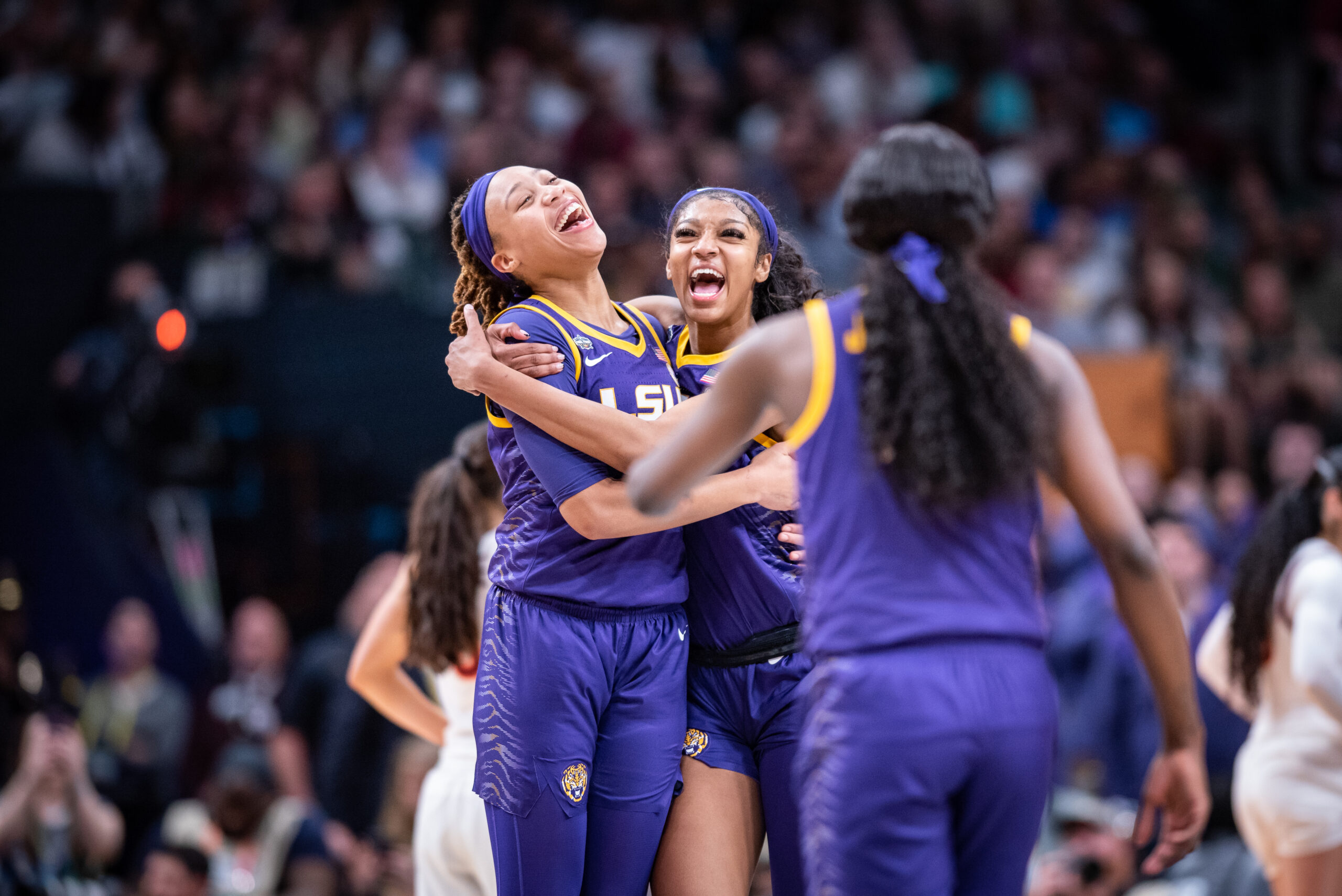 Angel Reese and LaDazhia Williams of LSU celebrate their Final Four victory over Virginia Tech on March 31, 2023, in Dallas, Texas. Photo Credit: Domenic Allegra