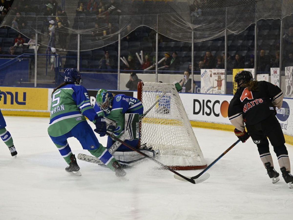 Abbie Ives of the Connecticut Whale making a save on Daryl Watts of the Toronto Six.