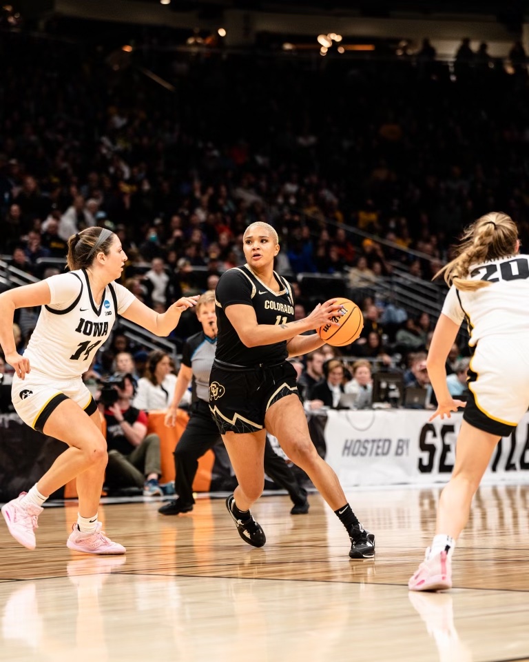 Colorado center Quay Miller gathers the ball and makes a move.