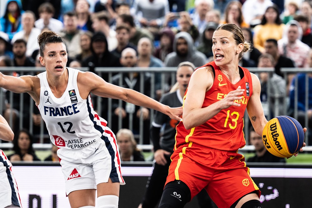France's Laetitia Guapo (12) defends Spain's Sandra Ygueravide (13) during the 2022 3x3 World Cup Quarterfinals.