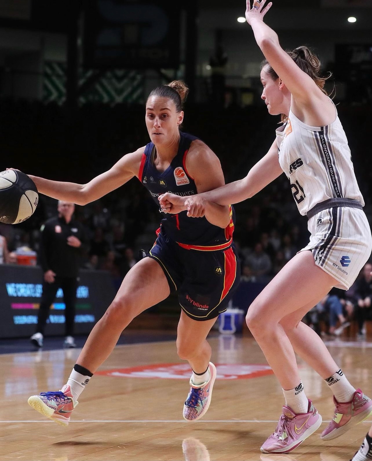 Stephanie Talbot drives past a defender playing for the Adelaide Lightning