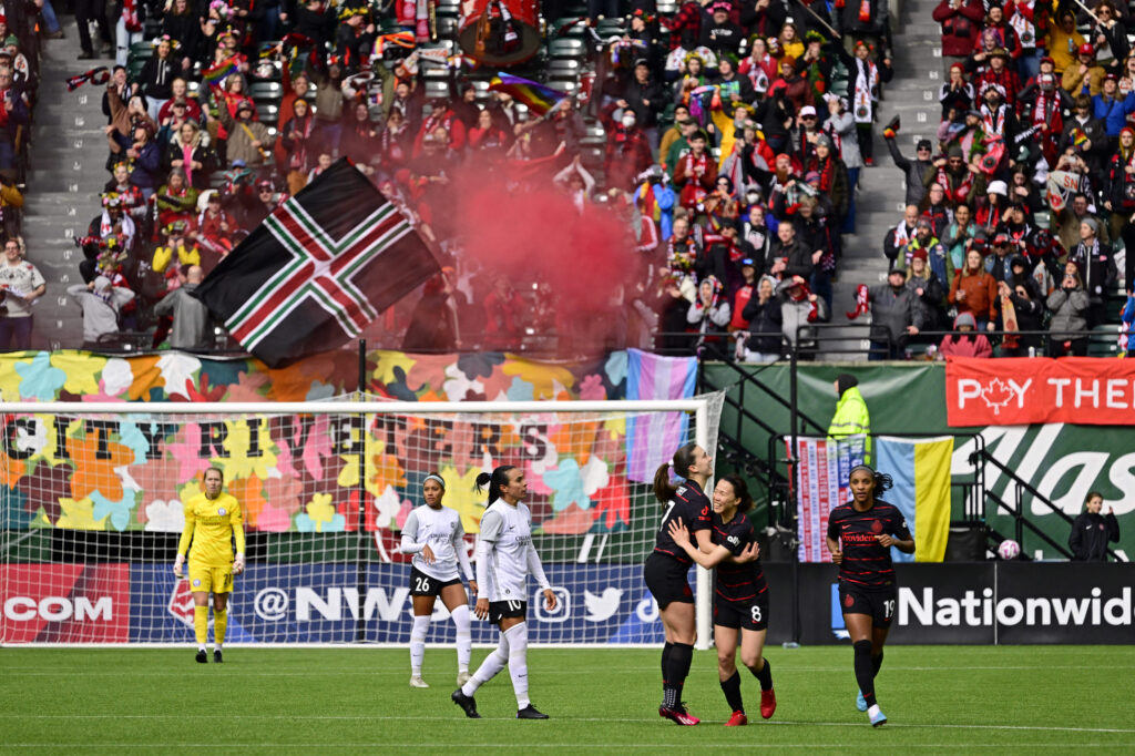 Mar 26, 2023; Portland, Oregon, USA; Portland Thorns FC midfielder Hina Sugita (8) is congratulated midfielder Sam Coffey (17) during the second half at Providence Park. Mandatory Credit: Troy Wayrynen-USA TODAY Sports