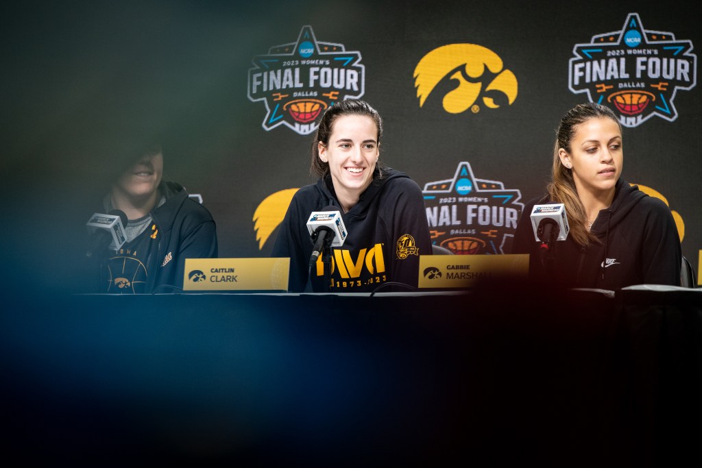 Caitlin Clark and Gabbie Marshall at an NCAA press conference.