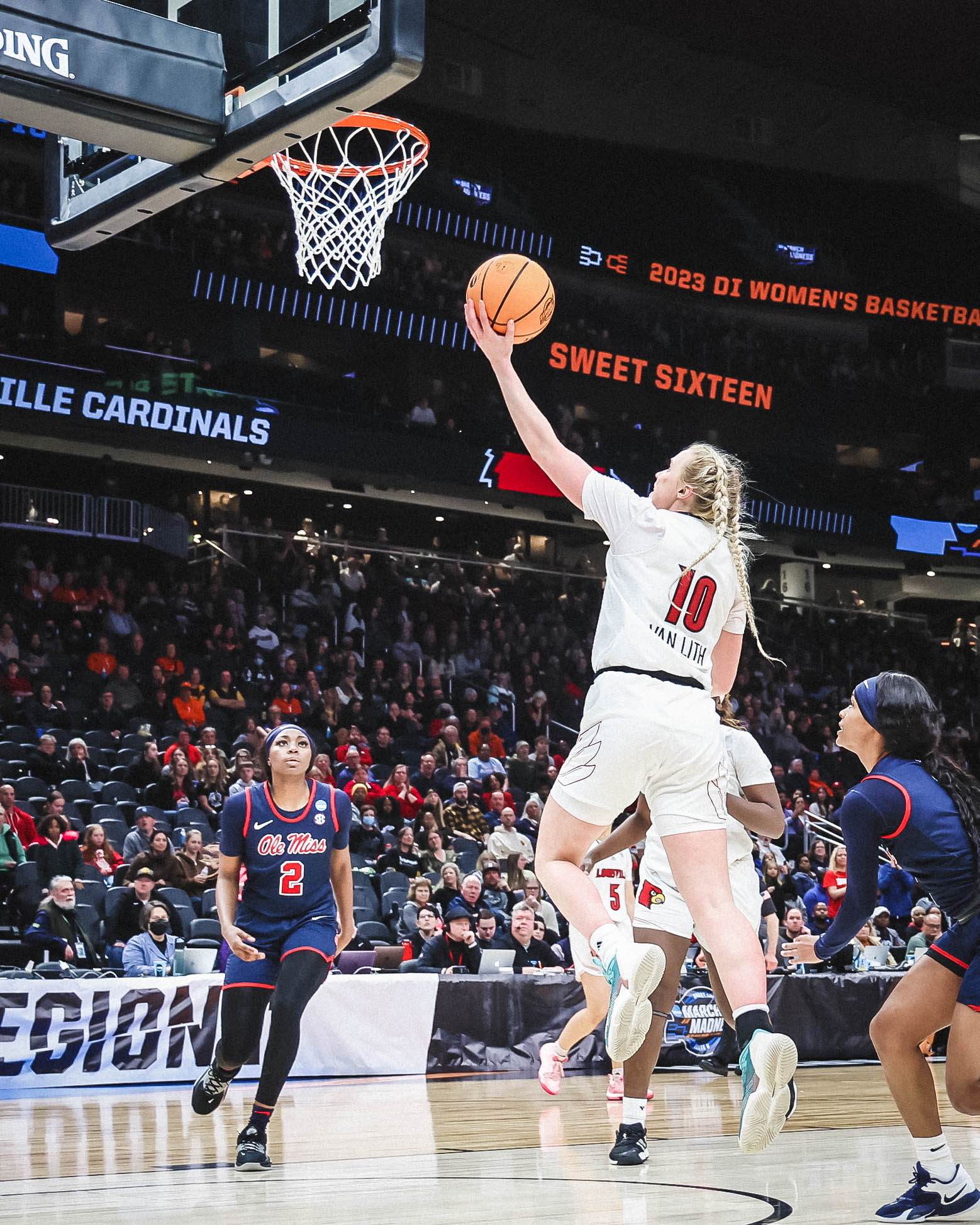 Louisville guard Hailey Van Lith shoots a left-handed layup as Mississippi defenders fail to contest.