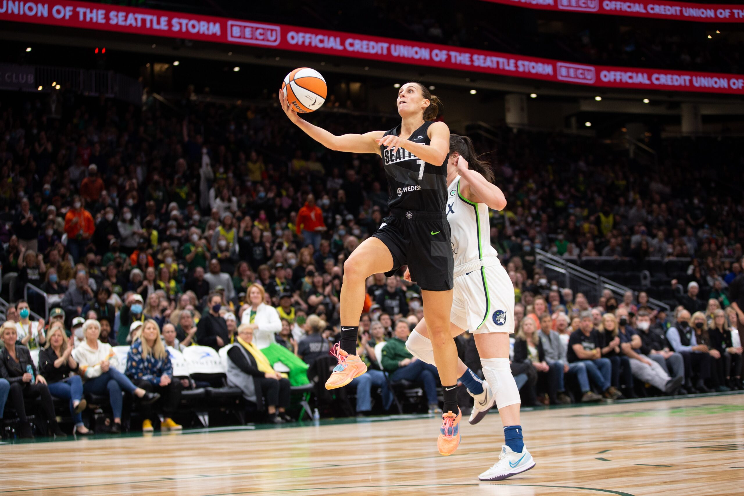 Stephanie Talbot drives past a Minnesota Lynx Defender on May 5, 2022.