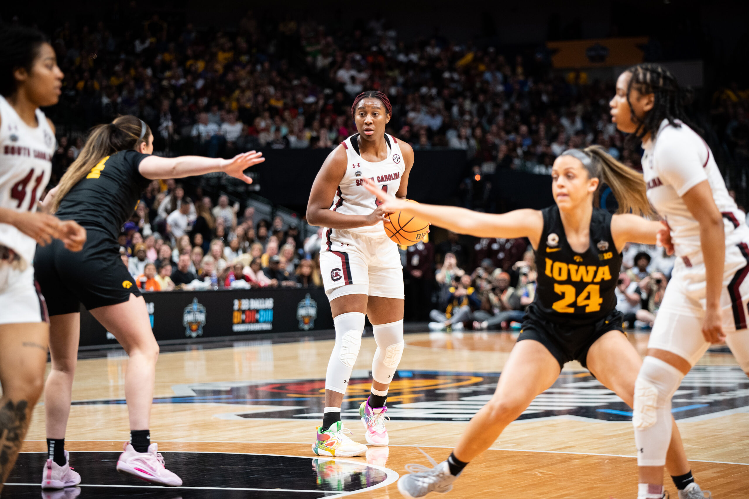 South Carolina forward Aliyah Boston holds the ball near the top of the key and surveys her options.