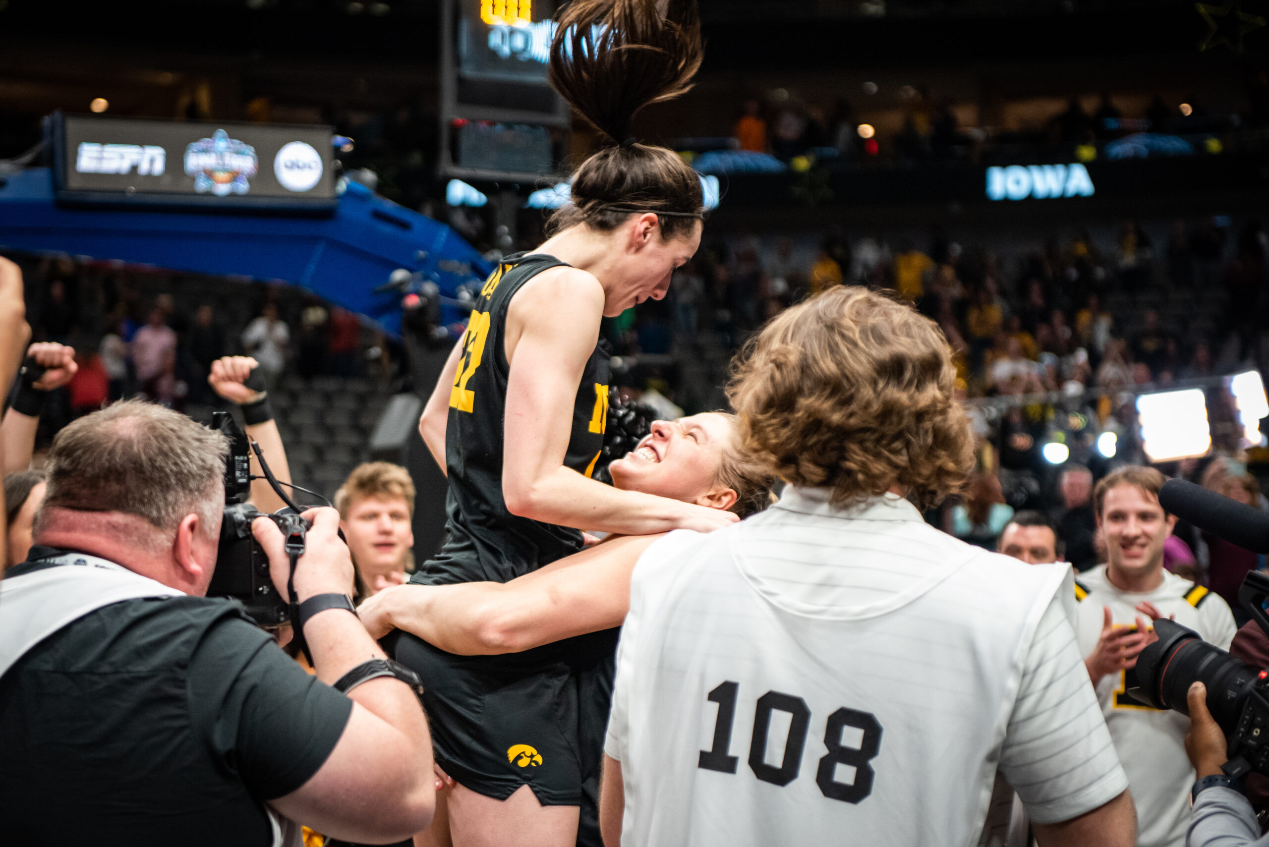 Monika Czinano lifts up Caitlin Clark after Iowa's 77-73 win over South Carolina on March 31. (Photo credit: Domenic Allegra | The Next)
