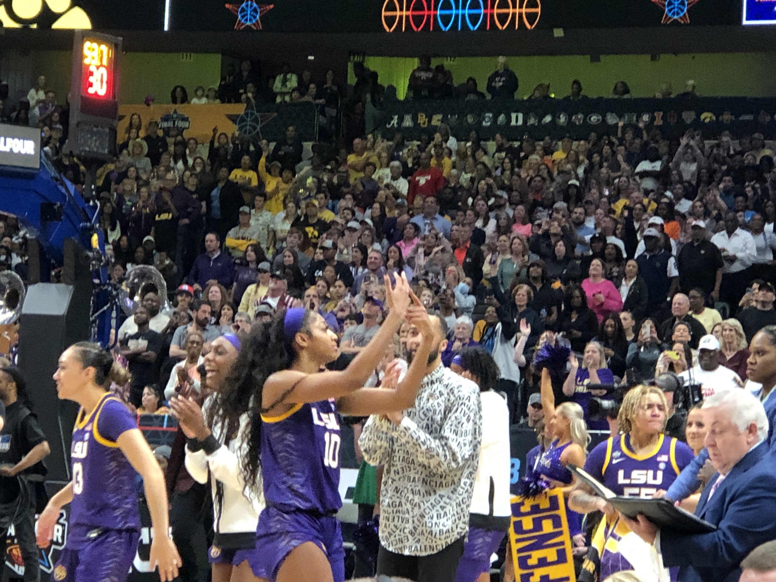 LSU's Angel Reese points to the finger she's going to use for her championship ring.