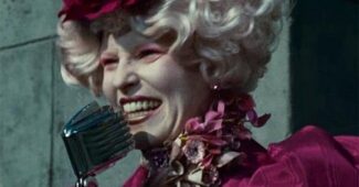Black and white photograph of Effie Trinket from The Hunger Games movie. Text over photo reads: "Transfer portal games: May the odds be ever in your favor."