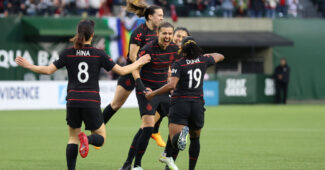 Apr 22, 2023; Portland, Oregon, USA; Portland Thorns FC forward Christine Sinclair (12) celebrates with teammates after scoring a goal during the first half against Racing Louisville FC at Providence Park. Craig Mitchelldyer-USA TODAY Sports