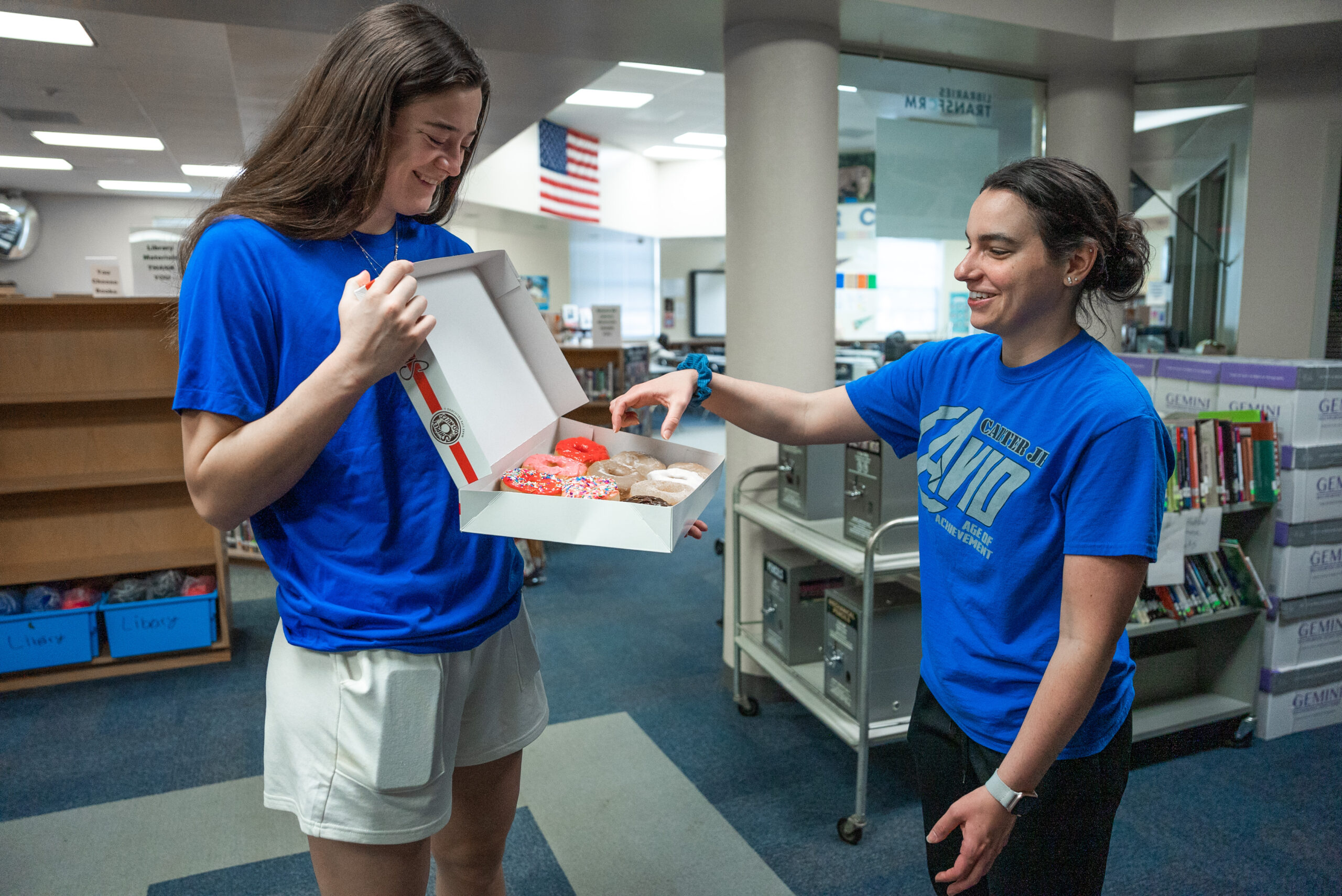Maddy Siegrist delivers Krispy Kreme doughnuts to teachers at Carter Jr. High School in Arlington, TX. (Photo via Dallas Wings)