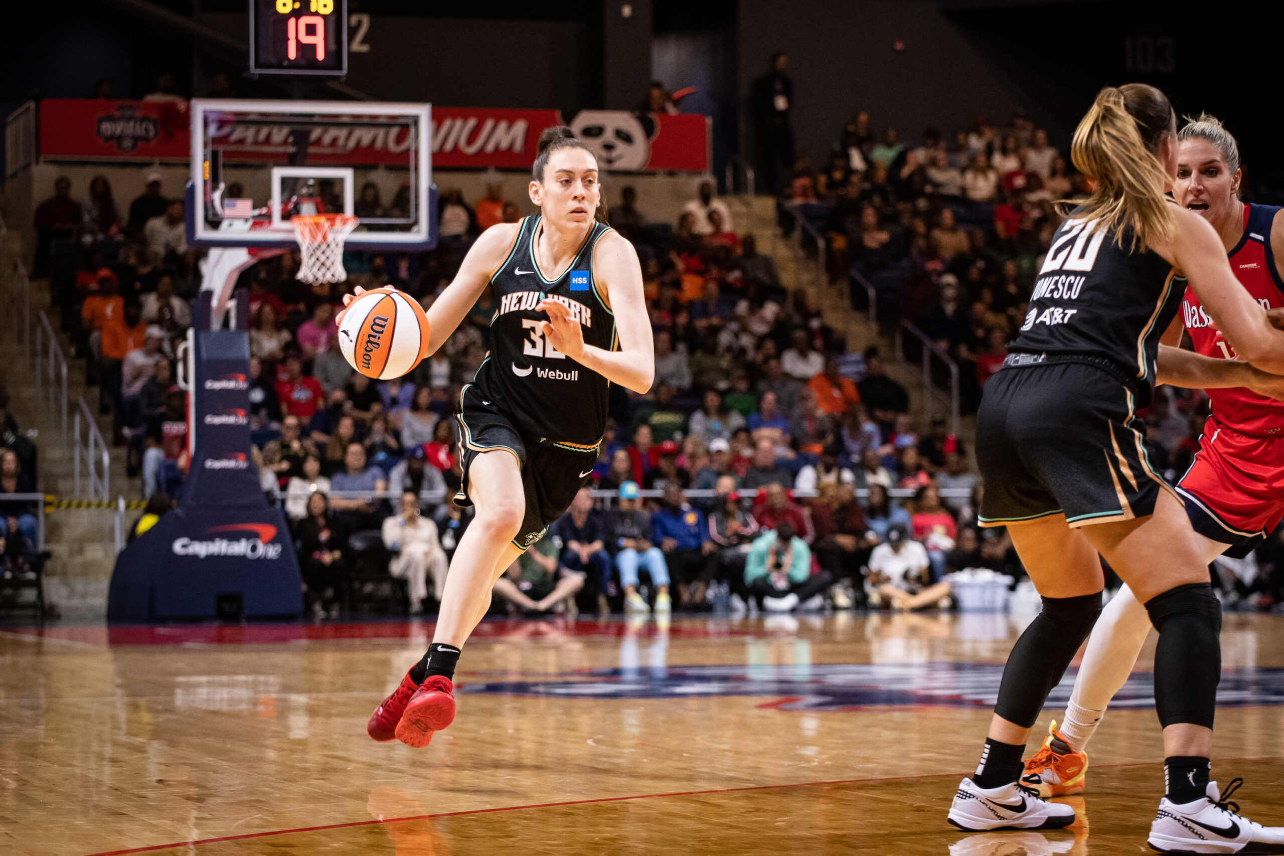 New York Liberty forward Breanna Stewart drives the ball with her right hand from outside the 3-point line as guard Sabrina Ionescu sets a screen inside the arc.