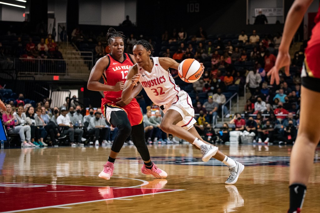 Washington Mystics guard Shatori Walker-Kimbrough drives into the lane with her left hand as Las Vegas Aces guard Chelsea Gray tries to recover.