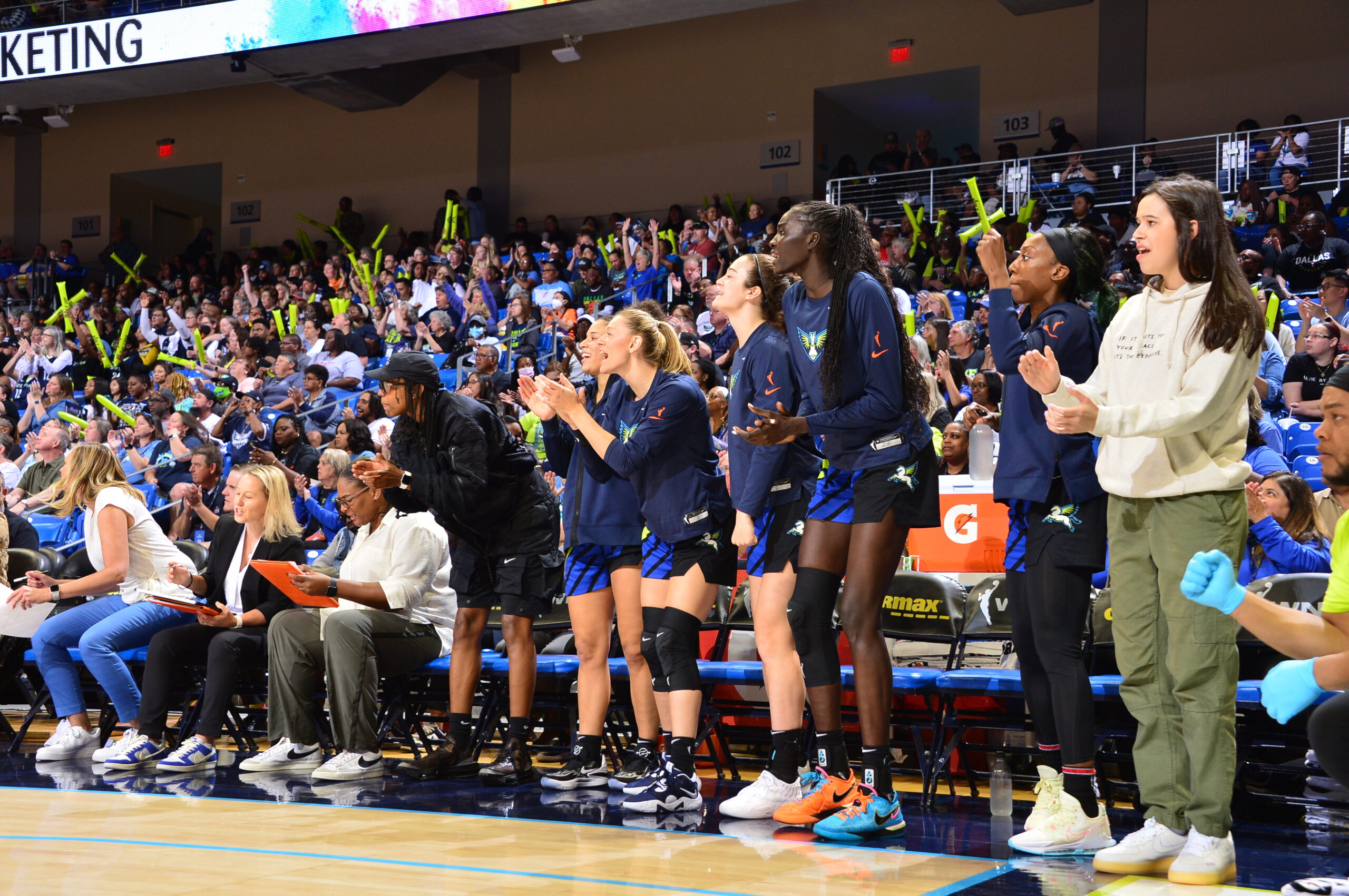 The Dallas Wings bench celebrates during a game against the Atlanta Dream. (photo via Dallas Wings)